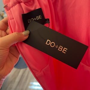 Pink off the shoulder mini dress.